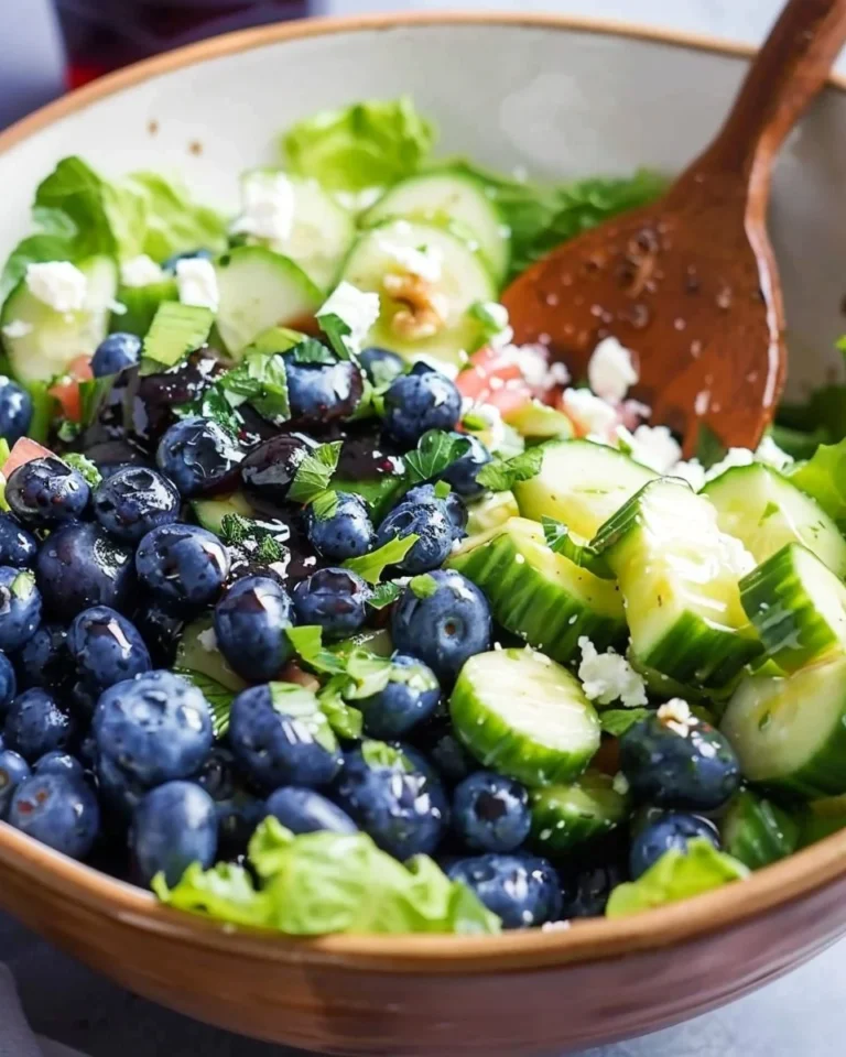 Colorful blueberry summer salad with greens and fresh fruit