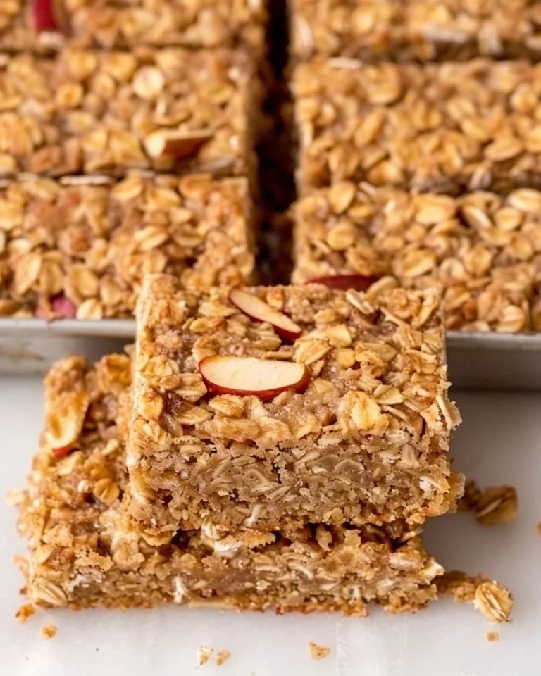 Delicious homemade apple oatmeal bars on a wooden table